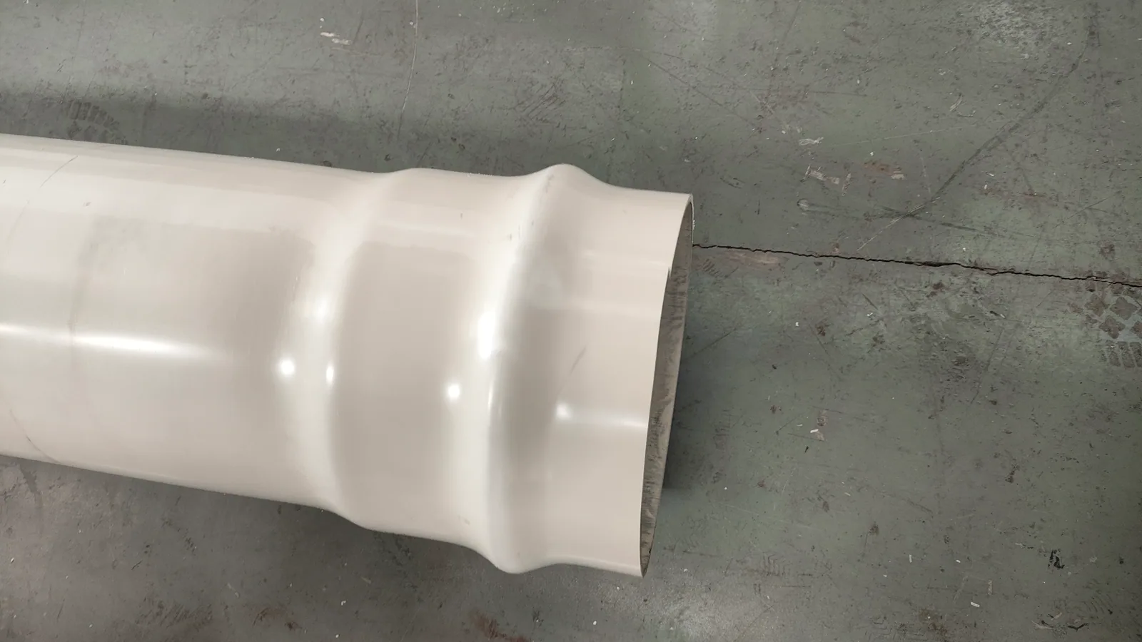 Finished PVC pipe socket sample after belling and cooling