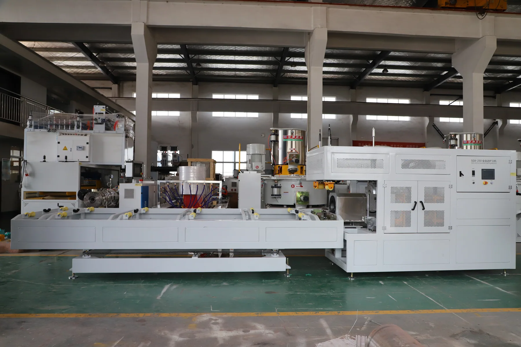 Full automatic pipe belling machine side view with control and forming stations