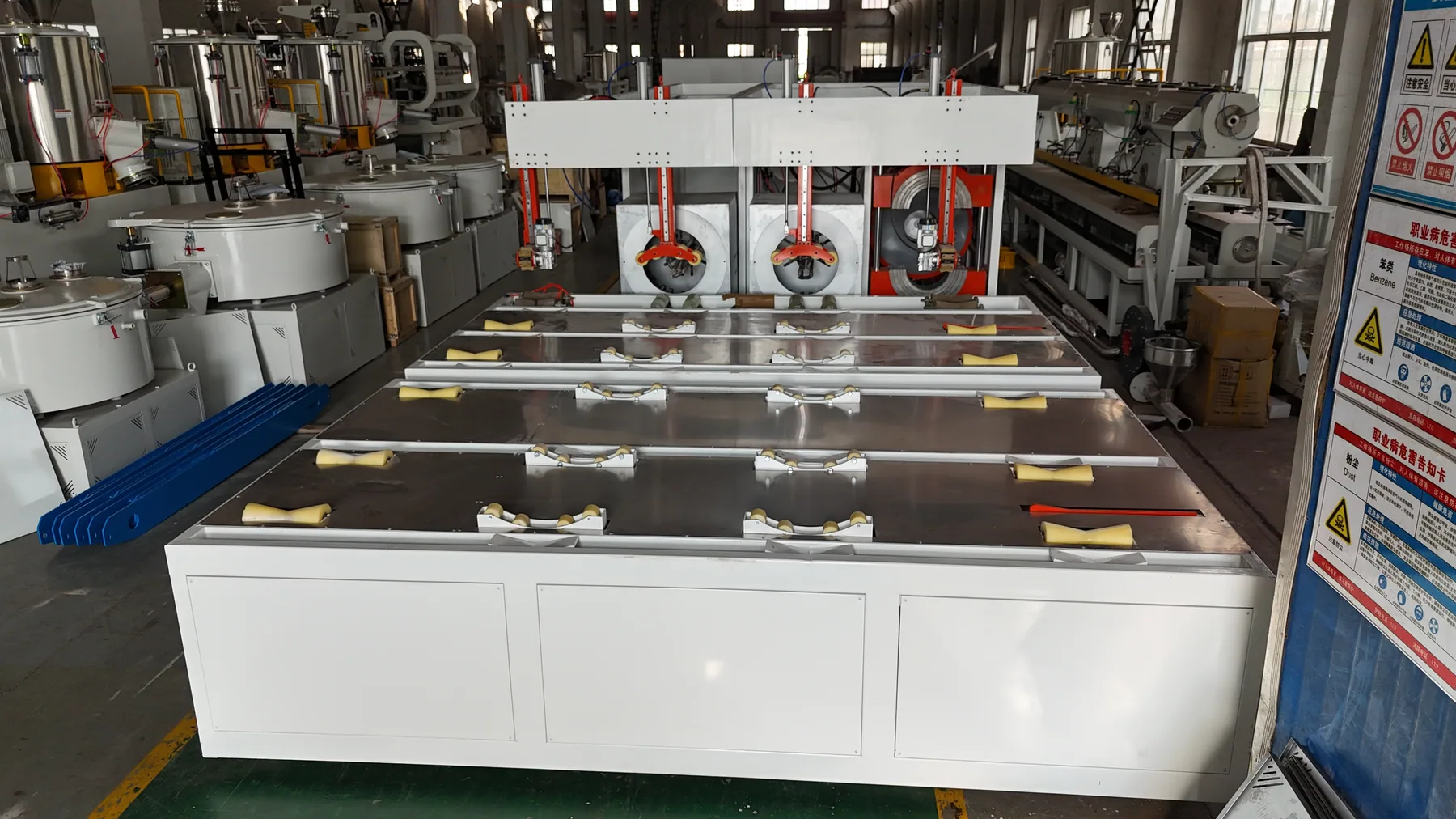 Full automatic pipe belling machine workshop overview with feeding and forming sections