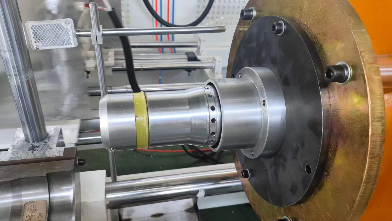 Close-up of pipe belling mould and formed PVC pipe socket