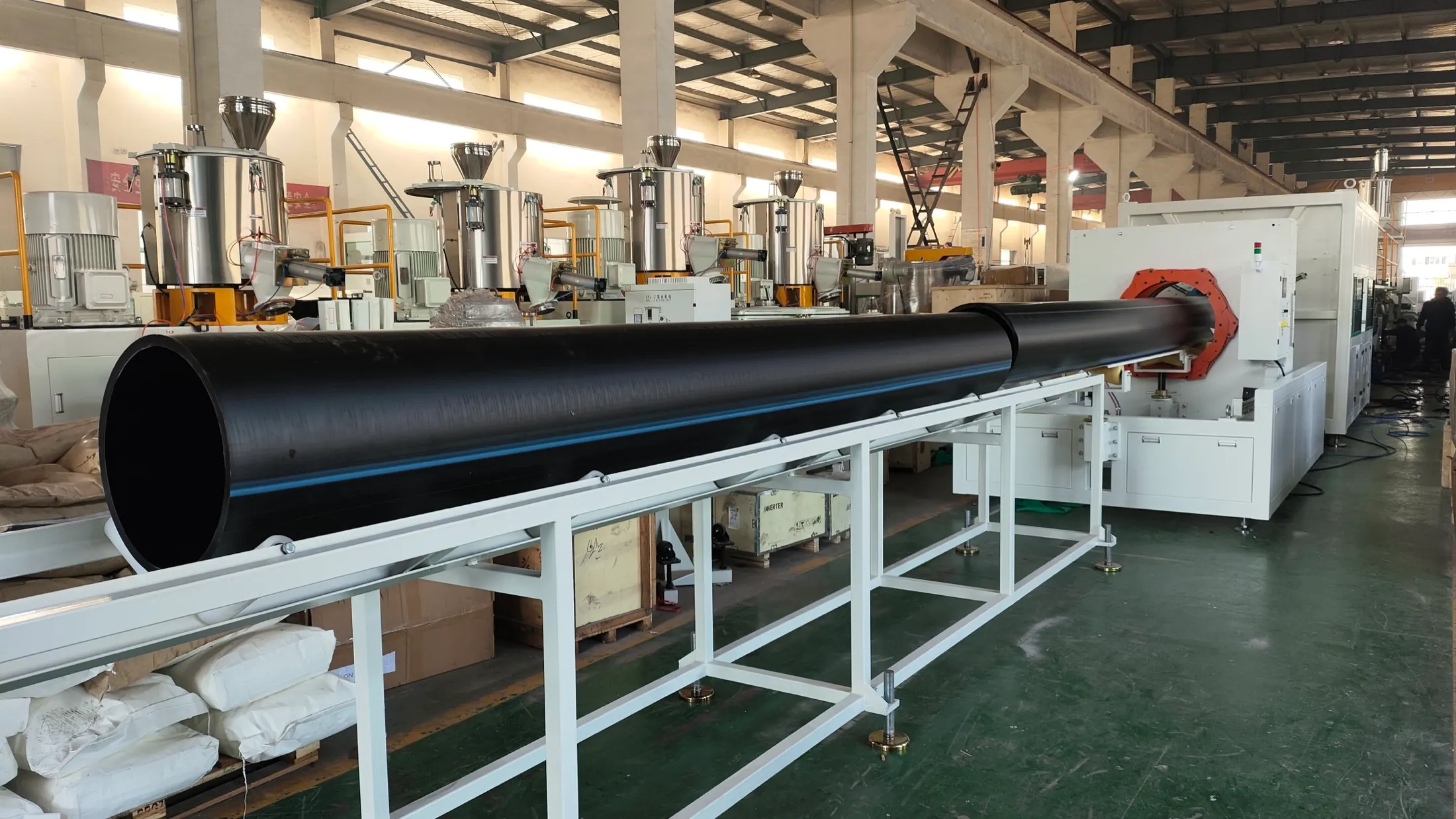 Large diameter HDPE pipe being produced on the factory extrusion line