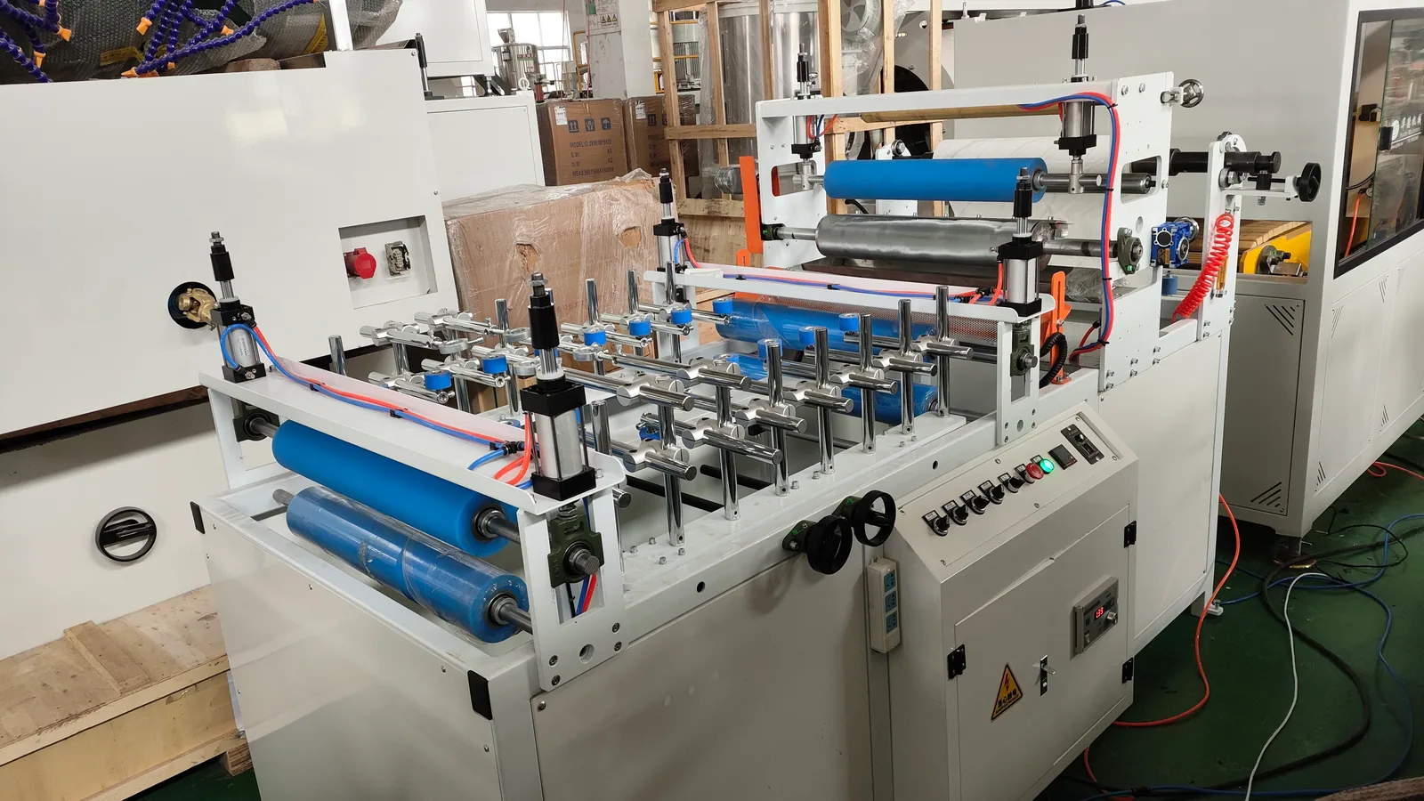 Lamination machine applying decorative film to PVC ceiling panel