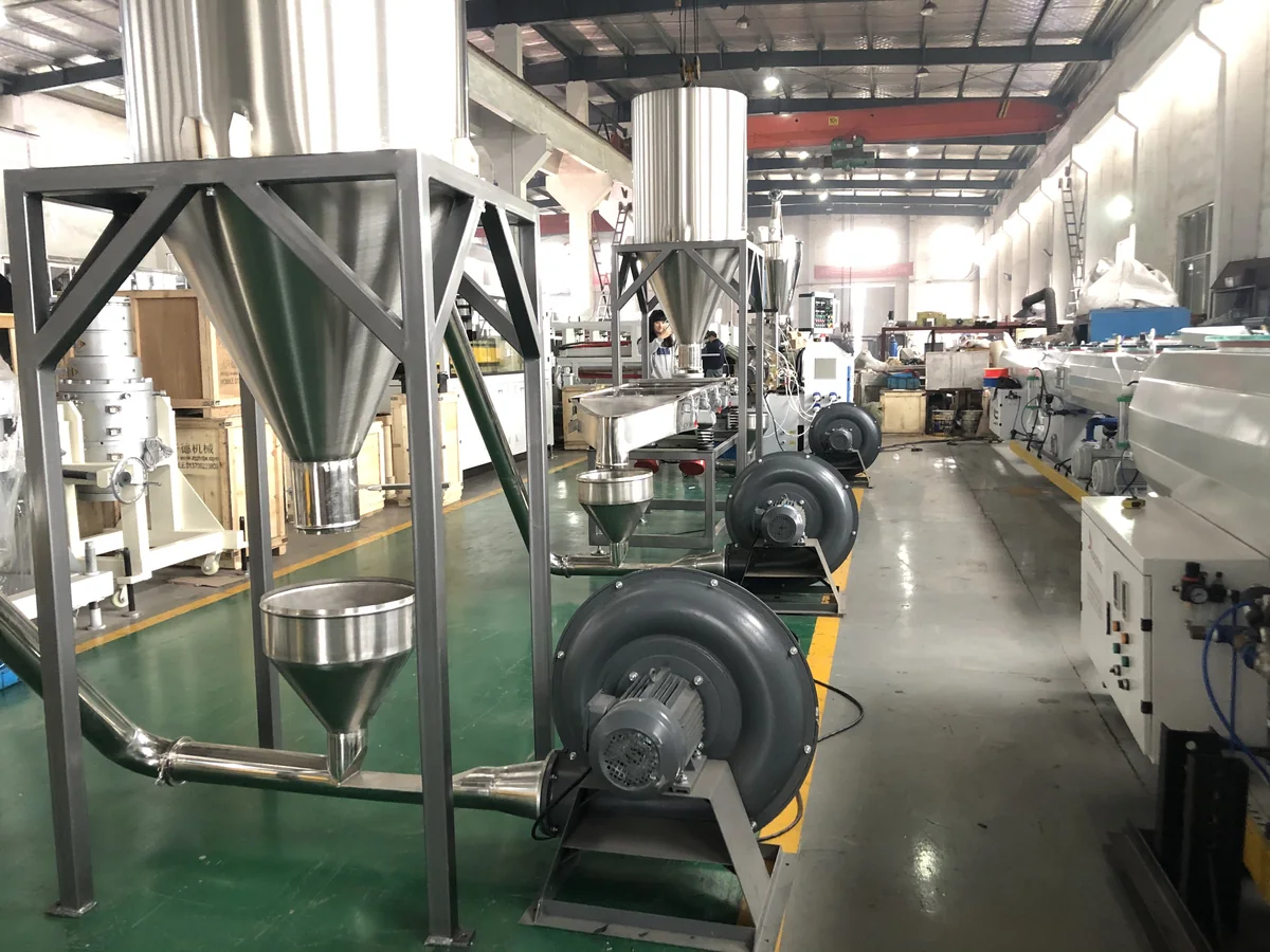 Air conveying cooling system for PVC pellets
