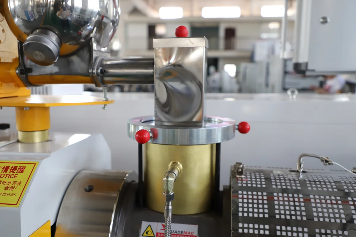 Close-up of twin screw extruder vacuum venting and barrel section