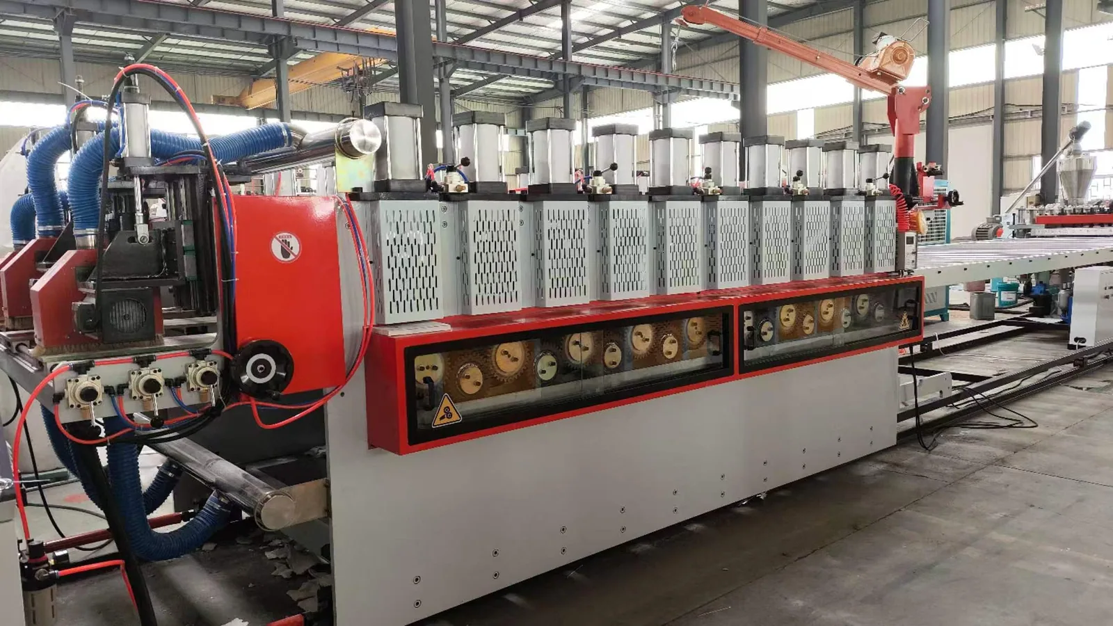 Haul off machine pulling PVC foam board through downstream line