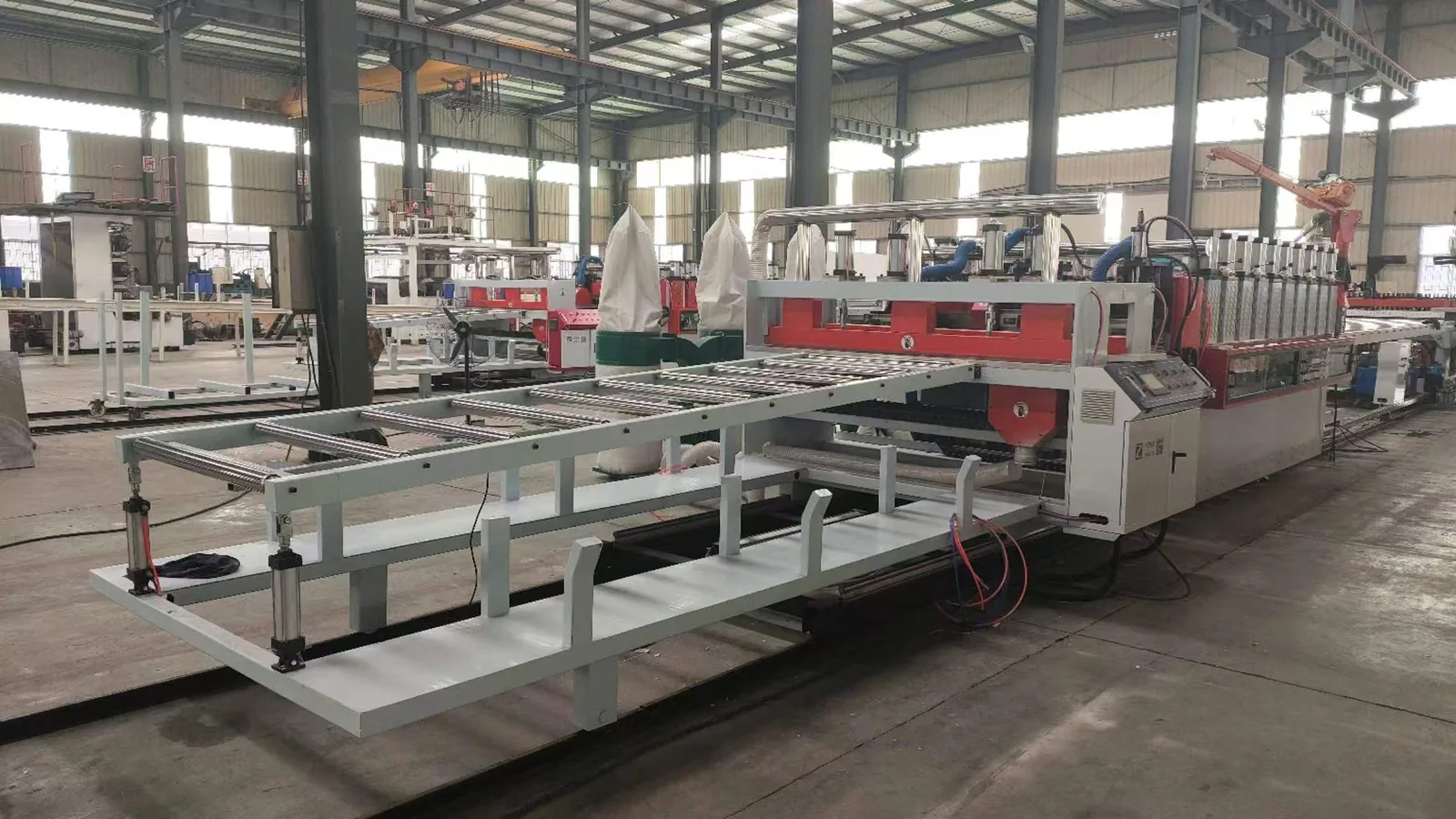 Stacker table for finished PVC WPC foam boards after cutting
